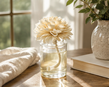 Painted Petals flower diffuser with natural wood flower and fragrance oil styled on a sunlit wood table.