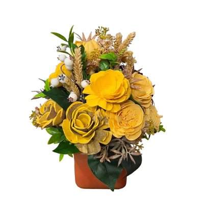 Back view of Golden Meadow yellow wood flower arrangement with greenery and natural botanical accents.