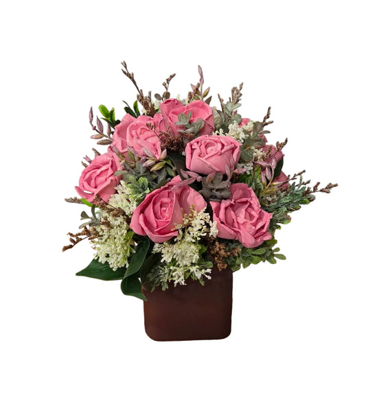 Rosewood Garden dusty pink wood flower arrangement with soft greenery and botanical accents in a square container.